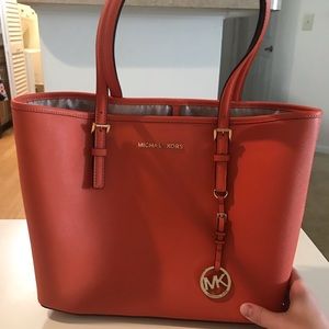 Michael Kors marching bag and wallet